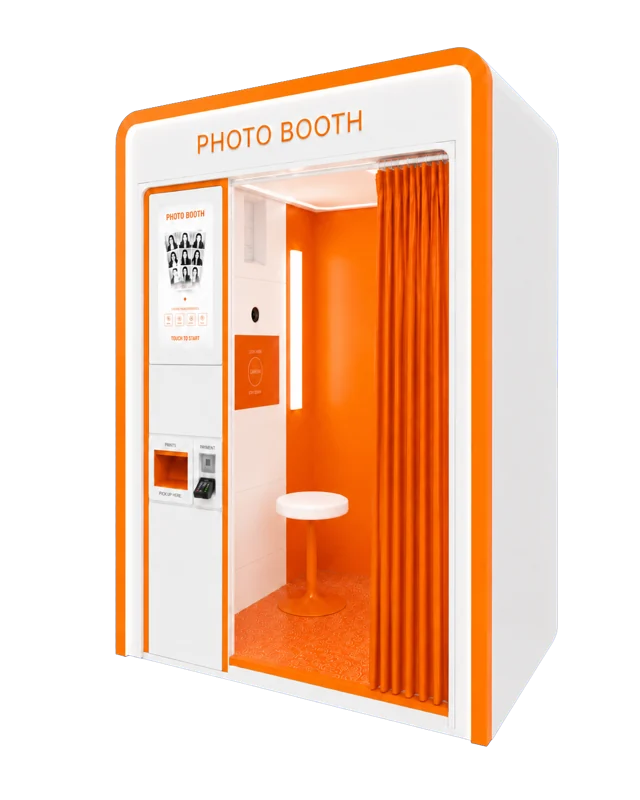 Orange and white photobooth with a touchscreen and privacy curtain